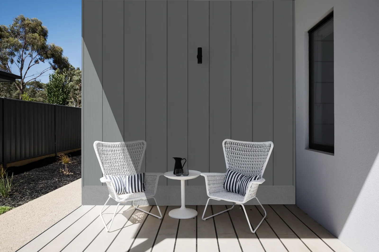 Fortex Clic storm grey cladding on a modern patio wall in vertical layout